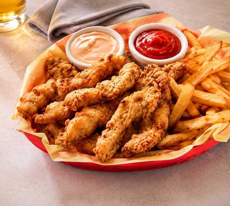 Idaho finger steaks in a basket with fry sauce and fries